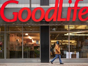 A man walks by a closed GoodLife Fitness centre in Toronto on Jan. 5, 2022.