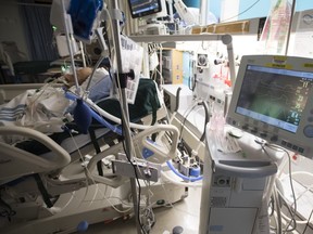 A patient is attached to a ventilator in the COVID-19 intensive care unit at St. Paul's hospital in downtown Vancouver, April 21, 2020.
