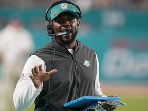 Miami Dolphins head coach Brian Flores directs his team during the second half of an NFL football game against the New England Patriots, Sunday, Jan. 9, 2022, in Miami Gardens, Fla.