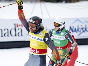 Canada’s Kristofer Mahler (left) celebrates his victory ahead of Germany’s Florianin Wilmsmann the men’s final at the World Cup ski cross event at Nakiska Ski Resort in Kananaskis, Alta., on Saturday.