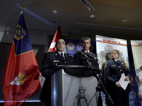 Supt. Peter Lambertucci, left, Officer in Charge INSET Ottawa answers questions from reporters as Chief Supt. Michael LeSage, Criminal Operations Officer, RCMP "O" Division and Kingston Police Chief Antje McNeely look on during a press conference, after RCMP charged a youth with terrorism, in Kingston, Ont. on Jan. 25, 2019.