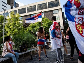 Supporters gather outside Park Hotel where Novak Djokovic was taken pending his removal from the country after his visa was cancelled by the Australian Border Force on Jan. 6, 2022 in Melbourne, Australia.