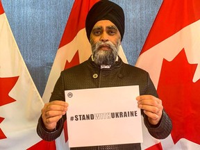 An image posted to his Twitter account of Liberal MP Harjit Sajjan holding a #StandWithUkraine sign.
