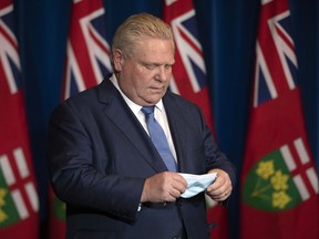 Ontario Premier Doug Ford attends a news conference in Toronto on Monday, Jan. 3, 2022.