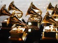 In this file photo taken on Jan. 28, 2018, Grammy trophies sit in the press room during the 60th Annual Grammy Awards in New York.