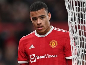In this file photo taken on Jan. 3, 2022 Manchester United's English striker Mason Greenwood is substituted during the English Premier League football match between Manchester United and Wolverhampton Wanderers at Old Trafford in Manchester, north west England.