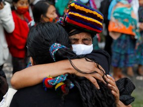 Women react after the guilty verdict in the trial of five former Guatemalan paramilitaries at the Supreme Court building in Guatemala City, Guatemala January 24, 2022.