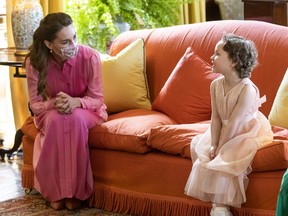 Catherine, Duchess of Cambridge meets Mila Sneddon, 5, and her family, at the Palace of Holyroodhouse on May 27, 2021 in Edinburgh, Scotland.