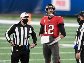 Tom Brady #12 of the Tampa Bay Buccaneers talks with officials during the second half against the New York Giants at MetLife Stadium on November 02, 2020 in East Rutherford, New Jersey. (Photo by Sarah Stier/Getty Images)