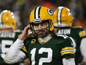 Quarterback Aaron Rodgers #12 of the Green Bay Packers reacts after failing to get a first down during the 2nd quarter of the NFC Divisional Playoff game against the San Francisco 49ers at Lambeau Field on January 22, 2022 in Green Bay, Wisconsin. (Photo by Quinn Harris/Getty Images)