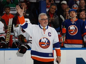 Former New York Islander Clark Gillies is honored prior to the game against the Chicago Blackhawks aat the Nassau Veterans Memorial Coliseum on December 13, 2014 in Uniondale, New York.
