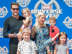 Actors Dean McDermott and Tori Spelling and their children arrive at the Super Heroes and Hollywood Stars Unite on the Red Carpet for Action-Packed Celebrity Family Premiere of the All-New Arena Spectacular Marvel Universe LIVE!, in Los Angeles, California, May 2, 2015.
