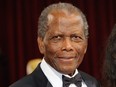Sidney Poitier arrives on the red carpet for the 86th Academy Awards in Hollywood, Calif., March 2, 2014.
