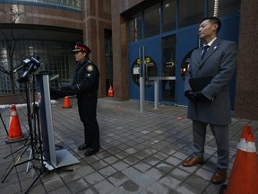 Toronto Police Homicide Staff Superintendent Lauren Pogue, (left) of Detective Operations, spoke about recent gun violence in the city and Detective Sergeant Rob Choe speaks at police headquarters and the eighth murder of the year that happened in an underground at 72 Gamble.
