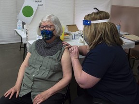 Corrie Watt receives a COVID-19 vaccine from Pauline Layland, RN, at a clinic in Halifax, April 16, 2021.