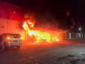 A fire burns at the Double O nightclub where at least 19 people were killed in clashes between two groups, in Sorong in Indonesia's West Papua province on January 25, 2022.