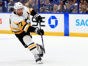 Jeff Carter of the Pittsburgh Penguins shoots during a game against the Tampa Bay Lightning at Amalie Arena on October 12, 2021 in Tampa.