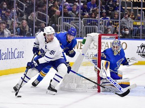 Maple Leafs captain John Tavares carries the puck behind the Blues net during a win in St. Louis on Saturday.