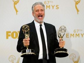 Jon Stewart holds his awards for Outstanding Writing For A Variety Series and Outstanding Variety Talk Series for Comedy Central's "The Daily Show With Jon Stewart" during the 67th Primetime Emmy Awards in Los Angeles, September 20, 2015.
