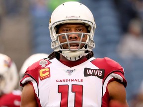Wide receiver Larry Fitzgerald of the Arizona Cardinals warms up before the game against the Seattle Seahawks in the game at CenturyLink Field on Dec. 22, 2019 in Seattle.
