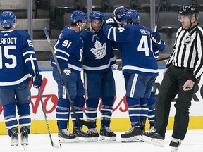 Toronto Maple Leafs defenceman TJ Brodie (78) celebrates scoring a goal with centre John Tavares (91) and defenceman Morgan Rielly (44) during the second period against the Ottawa Senators at Scotiabank Arena.