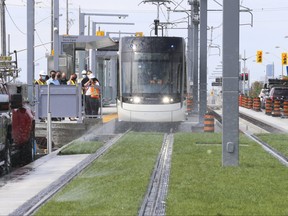 A Metrolinx Eglinton Crosstown Light Rapid Transit train is rolled out on Aug. 27, 2001 along a stretch of Eglinton Ave. E. through the 'Golden Mile' section of Scarborough from Victoria Park.