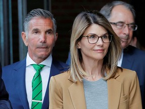 Actor Lori Loughlin, and her husband, fashion designer Mossimo Giannulli, leave the federal courthouse after facing charges in a nationwide college admissions cheating scheme, in Boston, Massachusetts April 3, 2019.