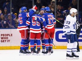 The Rangers celebrate a first-period goal by Ryan Reaves against the Toronto Maple Leafs at Madison Square Garden on Wednesday, Jan. 19, 2022 in New York.