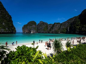 Tourists visit Maya Bay after Thailand reopened its world-famous beach at Krabi province January 3, 2022.