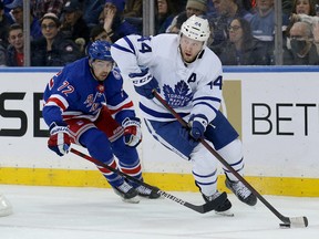 Maple Leafs defenceman Morgan Rielly (44) carries the puck against the New York Rangers on Jan. 19 at Madison Square Garden. Rielly is just two points shy of matching last year’s 55-game total of 35 points, and he's doing it in 17 fewer games.
