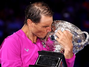 Rafael Nadal of Spain kisses the Norman Brookes Challenge Cup as he celebrates victory in his Men’s Singles Final match against Daniil Medvedev of Russia at the Australian Open at Melbourne Park on Jan. 30, 2022 in Melbourne, Australia.