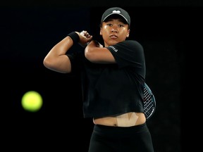 Naomi Osaka plays a backhand during a practice session ahead of the Australian Open at Melbourne Park on January 13, 2022 in Melbourne.