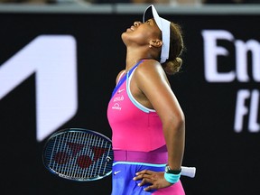 Naomi Osaka reacts as she plays against Amanda Anisimova during their match at the Australian Open in Melbourne on January 21, 2022.