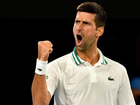 This file photo taken on Feb. 18, 2021 shows Serbia's Novak Djokovic reacting after a point against Russia's Aslan Karatsev during their men's singles semifinal match at the Australian Open in Melbourne.