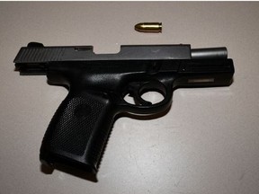 An image released by Toronto Police of a gun seized after a car crash on Saturday, Jan. 29, 2022.