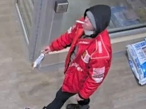 An image released by Toronto Police of a man sought in an arson at a Danforth and Woodbine Aves. bank on Jan. 25, 2022.