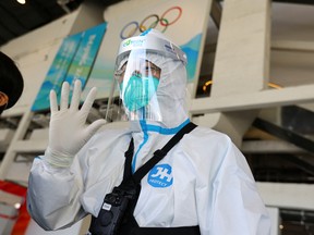 A Red Cross ambulance paramedic wears a protective suit as a protection from COVID-19 at the Main Press Centre ahead of the Beijing 2022 Winter Olympics in Beijing, China January 27, 2022.
