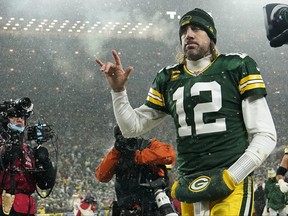 Green Bay Packers quarterback Aaron Rodgers gestures as he exits the field after losing the NFC Divisional Playoff game to the San Francisco 49ers at Lambeau Field on Jan. 22, 2022 in Green Bay, Wis.