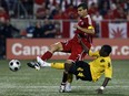 Canada's Paul Stalteri battles with Jamaica's Demar Phillips during qualifier for FIFA World Cup in South Africa.
