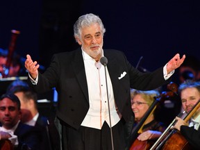 In this file photo taken on August 28, 2019 Spanish tenor Placido Domingo performs during his concert in the newly inaugurated sports and culture centre 'St Gellert Forum' in Szeged, Hungary.