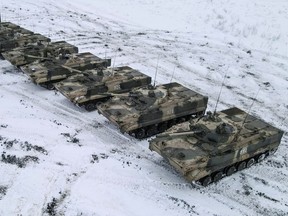 An aerial view shows Russian BMP-3 infantry fighting vehicles and a truck during drills held by the armed forces of the Southern Military District at the Kadamovsky range in the Rostov region, Russia, Jan. 27, 2022. Picture taken with a drone.