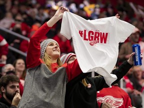 Red Wings fans hold up a t-shirt during the third period against the Blues at Little Caesars Arena in Detroit, Jan. 15, 2022.