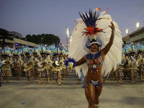 Drum queen Bianca Monteiro of Portela samba school performs during the first night of the Carnival parade at the Sambadrome in Rio de Janeiro, Brazil, Feb. 24, 2020.