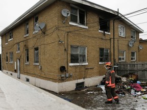 Toronto firefighters at the scene after six people were rescued, one through a window, from a three-alarm at a semi-detached home located on Lawrence Ave. on Wednesday, January 5, 2022.