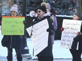 Browen Alsop, an Early Childhood Educator with two children, was part of a  small group of parents protesting outside the Ontario Legislature on Monday, Jan. 3, 2022.