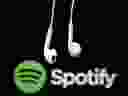 Headphones are seen in front of a logo of online music streaming service Spotify in this illustration picture taken in Strasbourg, Feb. 18, 2014.