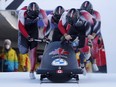Canada's Justin Kripps, Ryan Sommer, Cam Stones and Jay Dearborn in action during a four-man bobsleigh event in   Saint-Moritz, Switzerland, on Jan. 16, 2022.