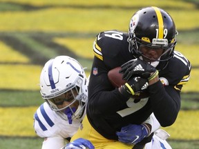 Pittsburgh Steelers wide receiver JuJu Smith-Schuster catches a pass for a touchdown during the 2020 season. He plans to play on Jan. 16, 2022, against Kansas City.  Charles LeClaire-USA TODAY Sports files