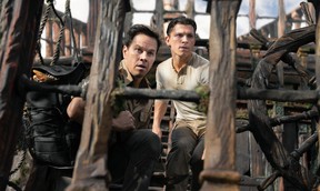 Victor “Sully” Sullivan (Mark Wahlberg) and Nathan Drake (Tom Holland) look to make their move in Columbia Pictures’ UNCHARTED.