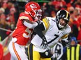 Ben Roethlisberger of the Pittsburgh Steelers throws the ball as Willie Gay Jr. of the Kansas City Chiefs defends at Arrowhead Stadium on January 16, 2022 in Kansas City, Missouri.
